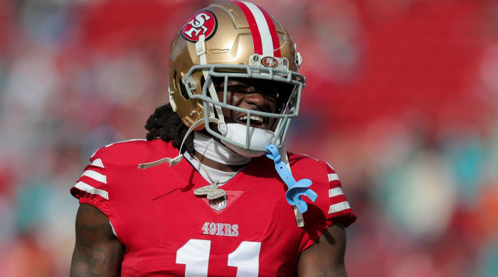 49ers wide receiver Brandon Aiyuk yells in between plays during a game.